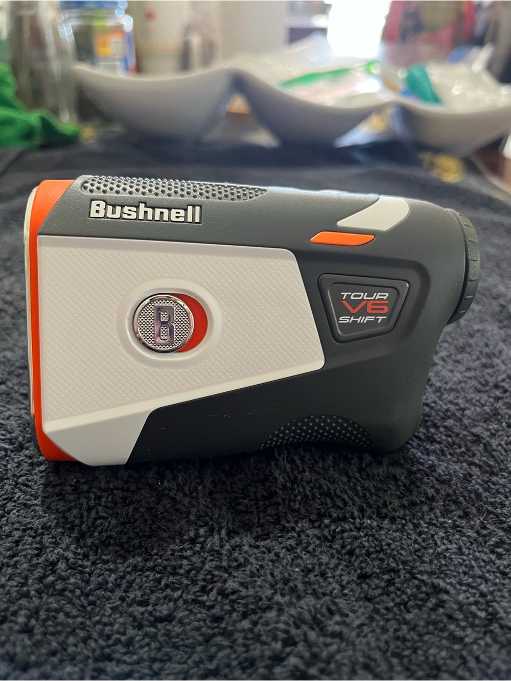 Bushnell Tour V6 Shift Rangefinder in Black/White with Orange Accents with Grip